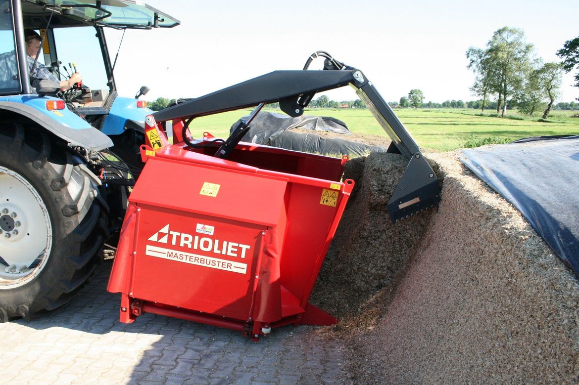 Autocargador distribuidor, carro alimentador