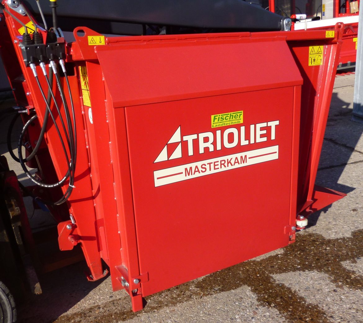 Autocargador distribuidor, carro alimentador